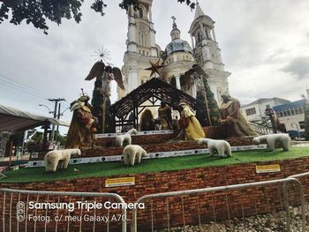 Statue of temple against building