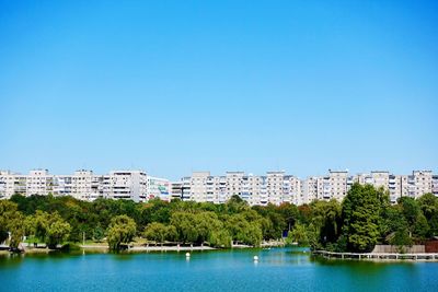 Block of flats at a park with pond in bucharest