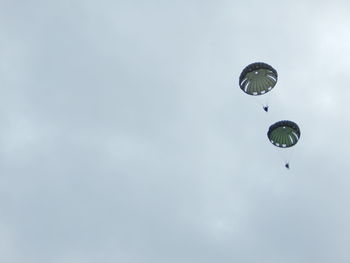 Low angle view of kite flying against sky