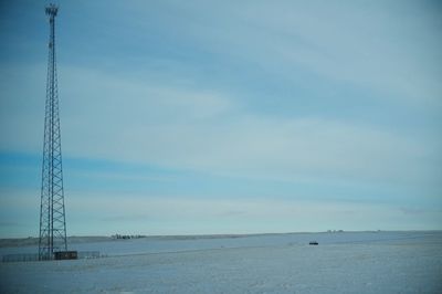 Scenic view of beach against blue sky