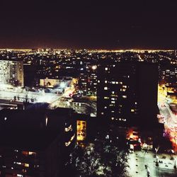 Illuminated cityscape at night