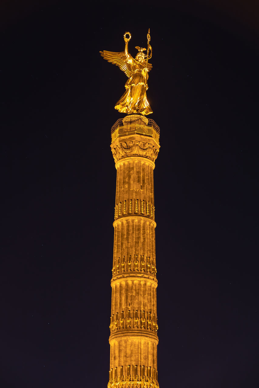 LOW ANGLE VIEW OF ILLUMINATED TOWER