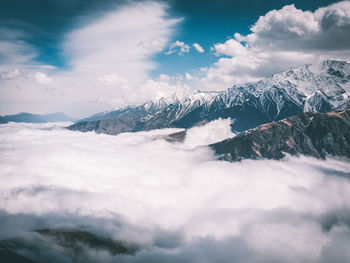 Scenic view of snowcapped mountains against sky