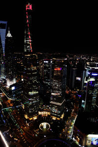 Aerial view of city lit up at night