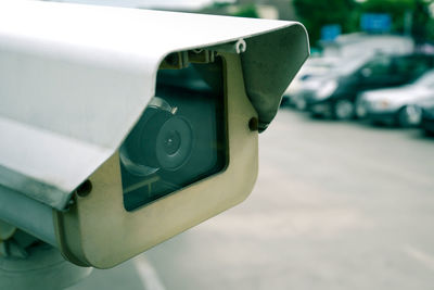 Security cctv camera in car park, shallow depth of field, filter effect