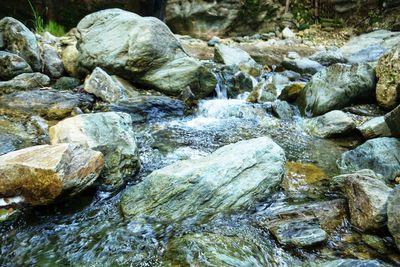 Close-up of water flowing through rocks