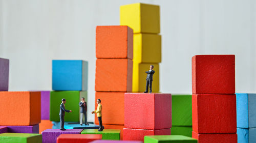 Close-up of figurines on toy blocks