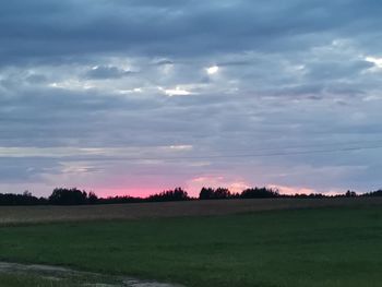 Scenic view of field against sky during sunset