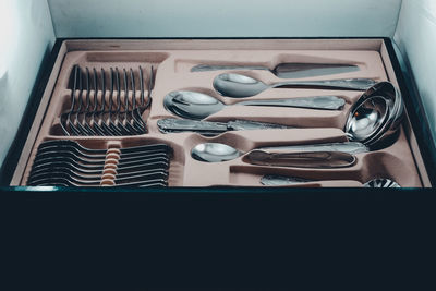 Close-up of spoons in box