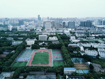 Aerial view of cityscape against sky