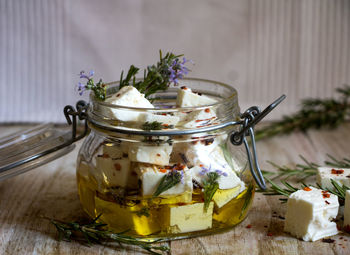 Close-up of ice cream in glass jar on table