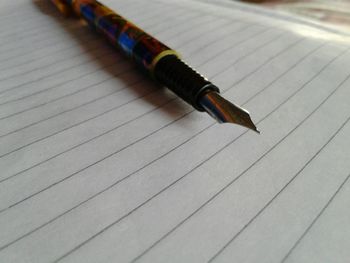 Close-up of pen on table