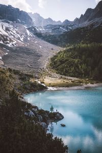 Scenic view of lake and mountains against sky