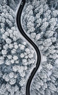 High angle view of car windshield on snow covered land