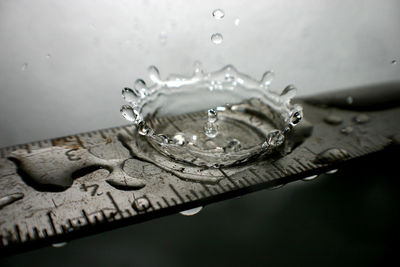 Close-up of water drops on metal