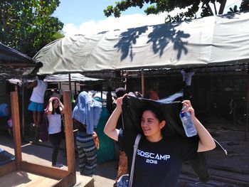 High angle view of friends standing against built structure