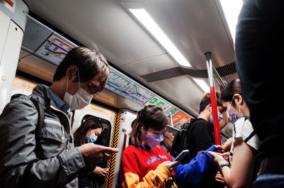 Rear view of people in train