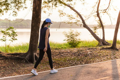 Full length of woman exercise walking in the park 