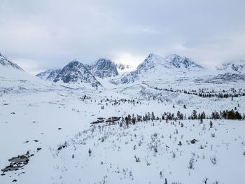 Scenic view of snowcapped mountains against sky