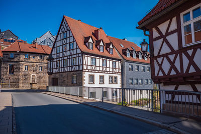 Buildings against clear blue sky