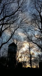 Low angle view of bare tree against sky