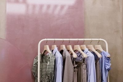 Close-up of clothes hanging on rack