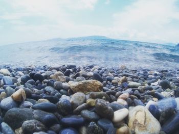 Scenic view of sea against cloudy sky