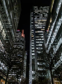 Low angle view of illuminated buildings at night