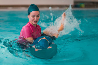 Boy swimming in pool