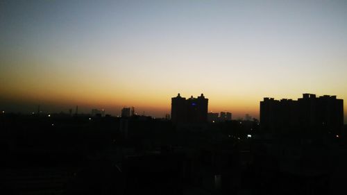 Silhouette of buildings at sunset