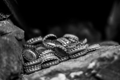 Close-up of bottle caps on steps