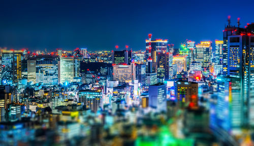 Illuminated buildings in city at night