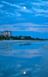 Calm sea against blue sky