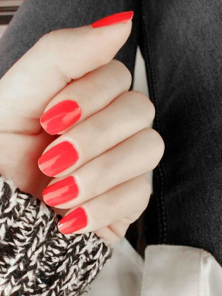 person, indoors, part of, holding, lifestyles, cropped, high angle view, human finger, close-up, red, leisure activity, nail polish, low section, midsection, femininity
