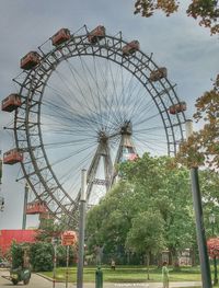 Low angle view of ferris wheel against sky