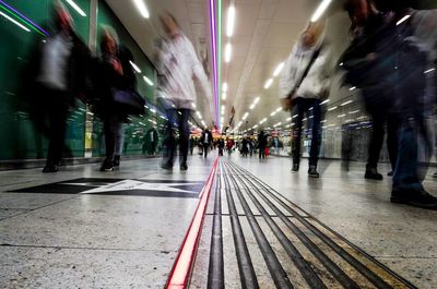 People at airport in city at night