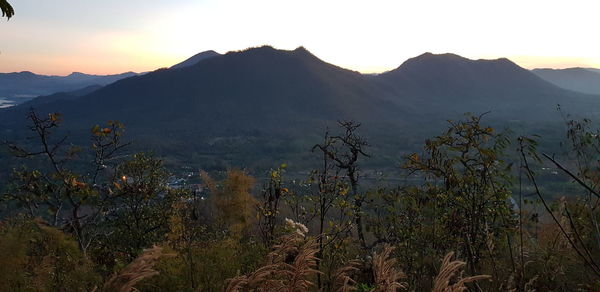 Scenic view of mountains against sky during sunset