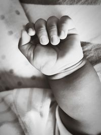 Close-up of baby feet on bed