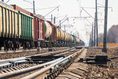 Train on railroad tracks against sky