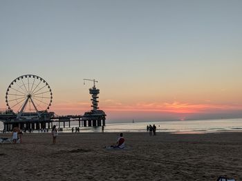 Scenic view of beach against sky during sunset