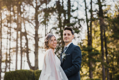 Young couple standing in forest