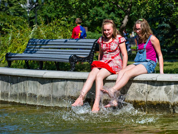 Girl sitting in water