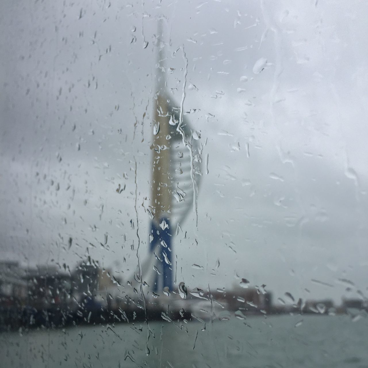 drop, wet, water, rain, weather, glass - material, transparent, window, raindrop, season, indoors, monsoon, focus on foreground, close-up, rainy season, built structure, building exterior, glass, splashing, sky