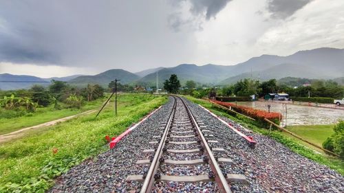 High angle view of railroad tracks on field against sky