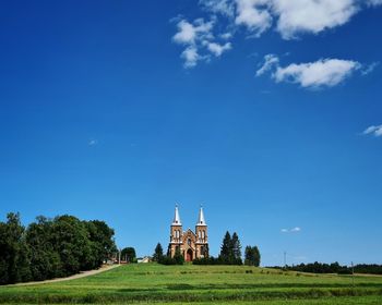 Built structure on field against sky