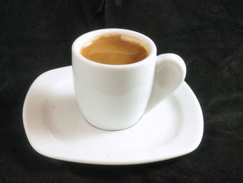 High angle view of coffee cup on table