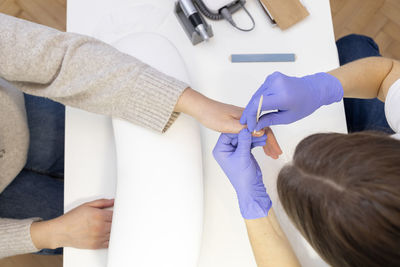 High angle view of woman washing hands in bathroom