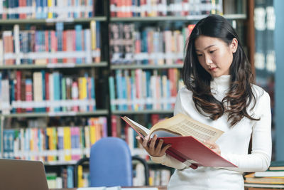 Portrait of woman reading book