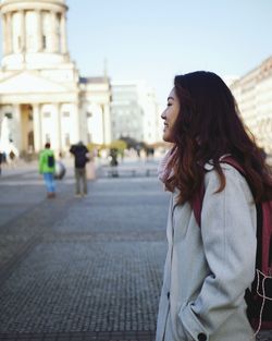 Side view of woman standing outdoors