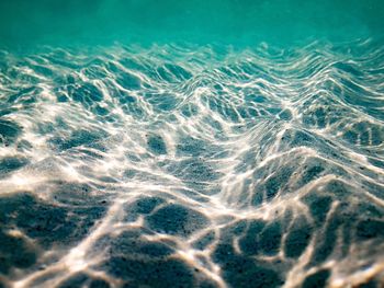 The sand dunes under the calm sea